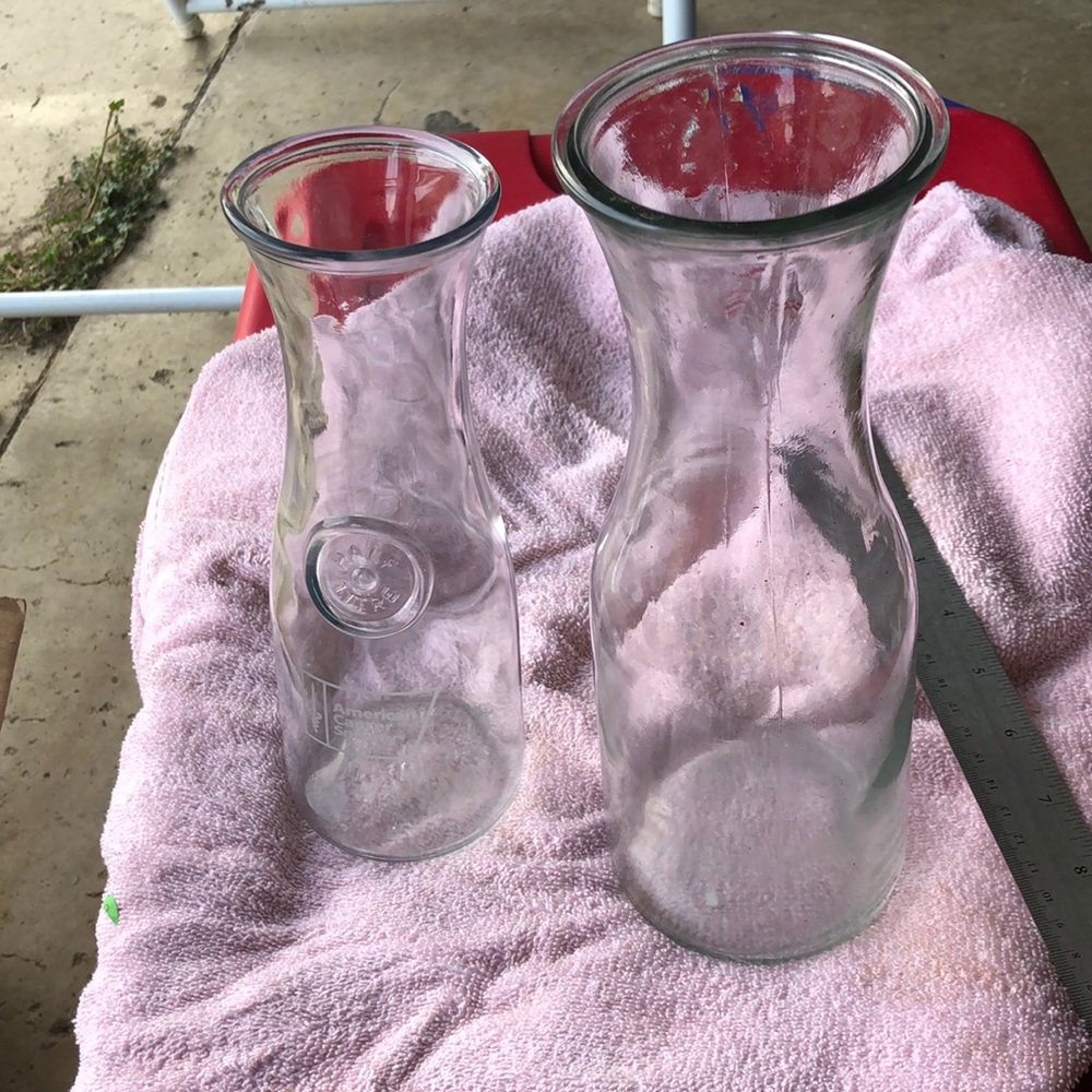 - Two milk bottle type vases